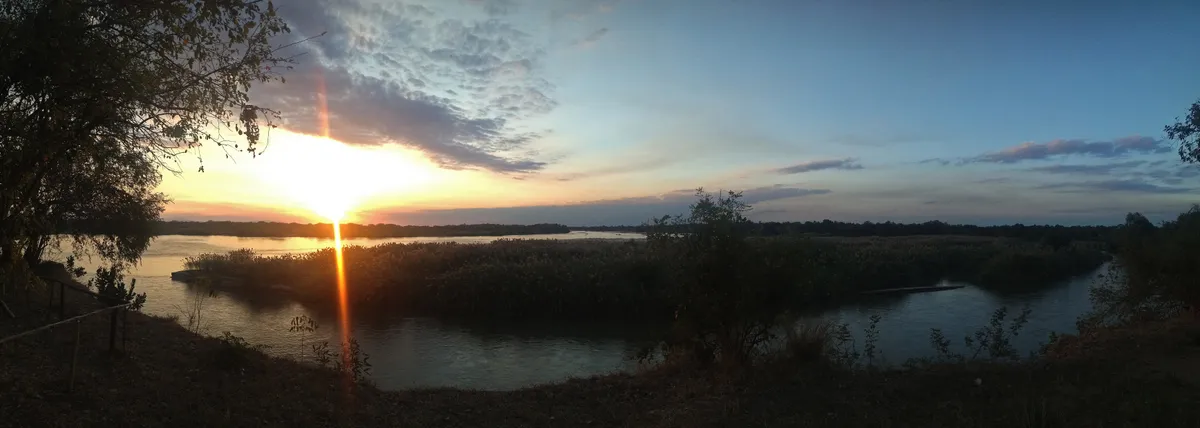 Wide sunset panorama over a river in the Selous region