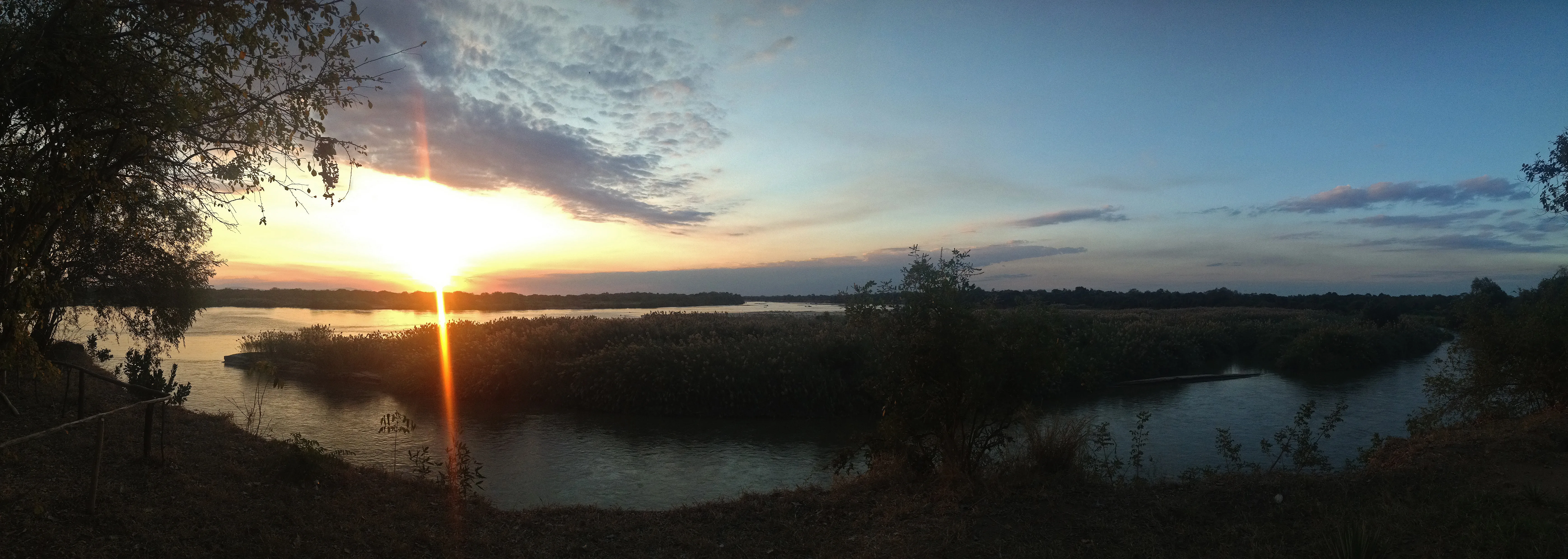 Wide sunset panorama over a river in the Selous region